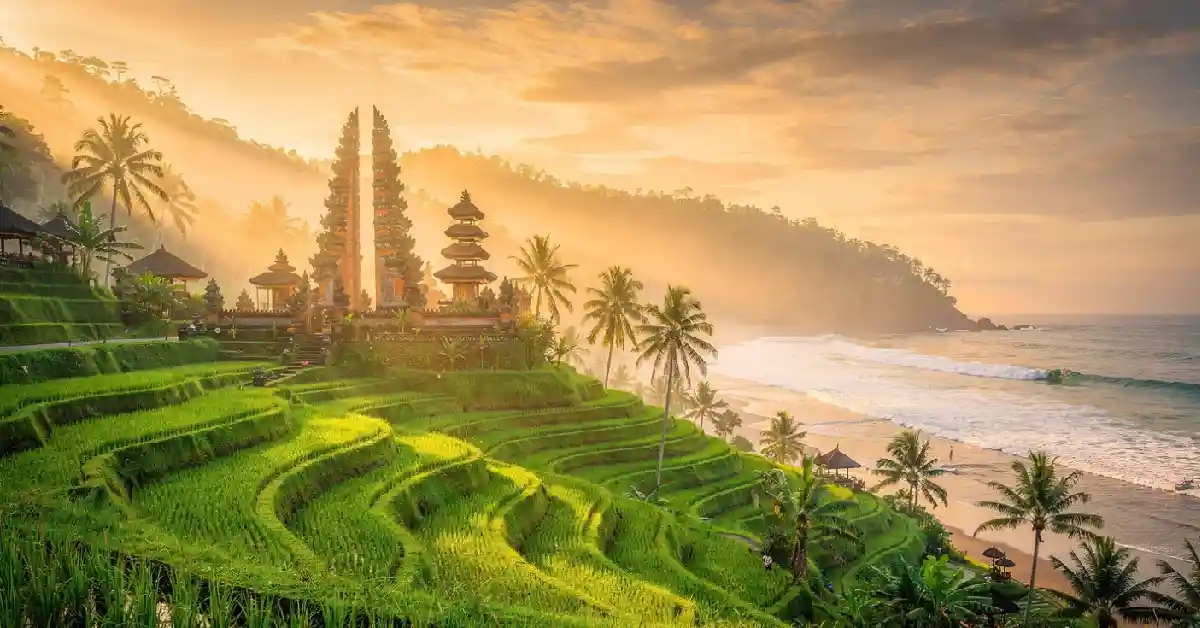 Bali travel tips - Stunning aerial sunrise view of rice terraces and temple in Bali