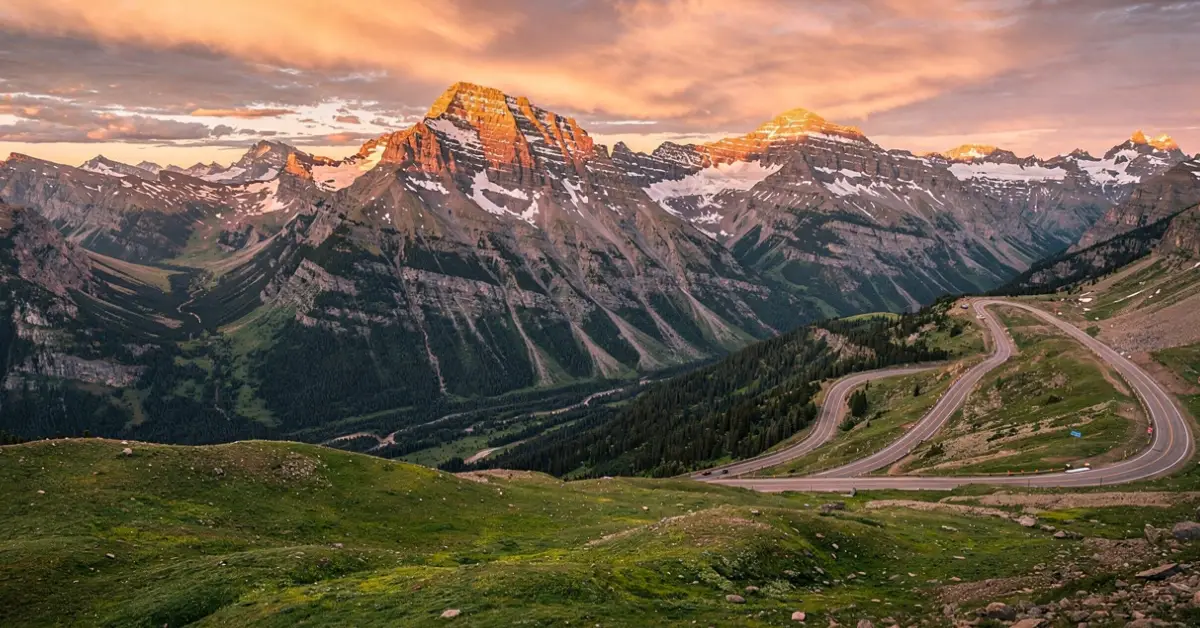 Aerial sunrise view of Rocky Mountain National Park Colorado with snow-capped peaks and golden alpine meadows