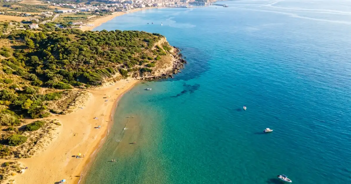 Aerial view of the golden sand and turquoise layered water at Capo San Marco beach in Sciacca Sicily Italy.