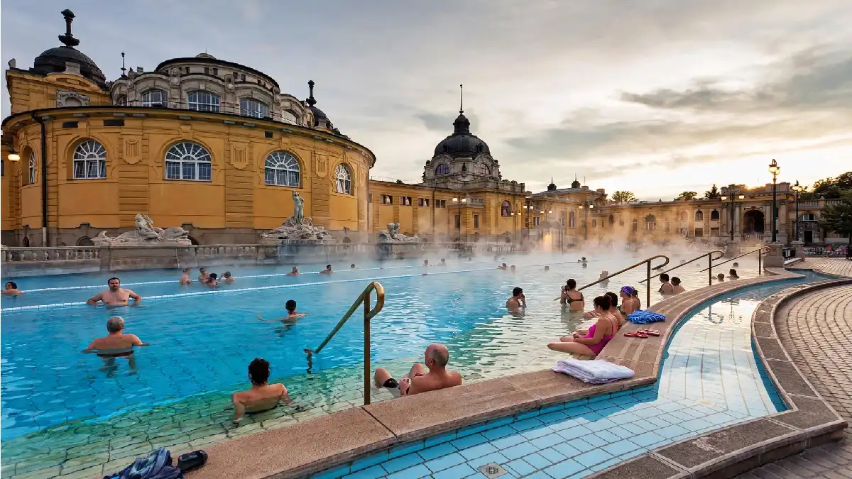 Outdoor pool at Széchenyi Thermal Bath in Budapest with steam rising.